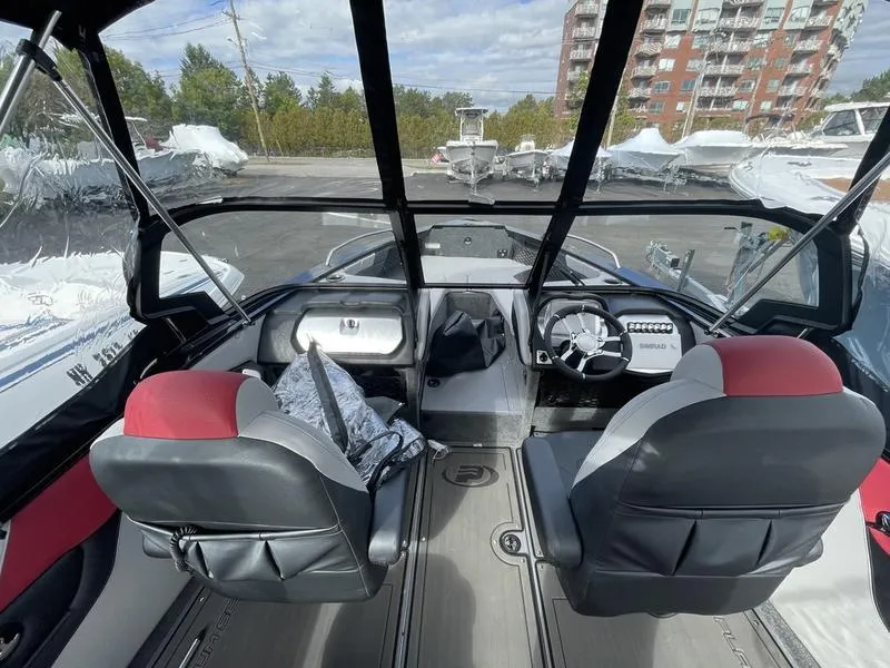 Slide: The Image of 2024 Princecraft AYB5258TS boat interior with dual seats and modern dashboard. - 9