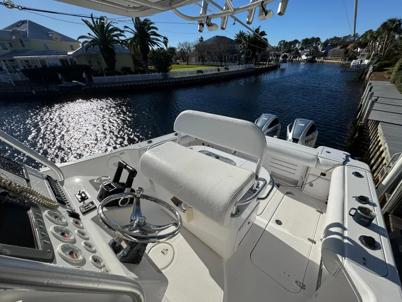 Slide: The Image of 2007 Pro-Line 29 Super Sport boat cockpit with canal view. - 12