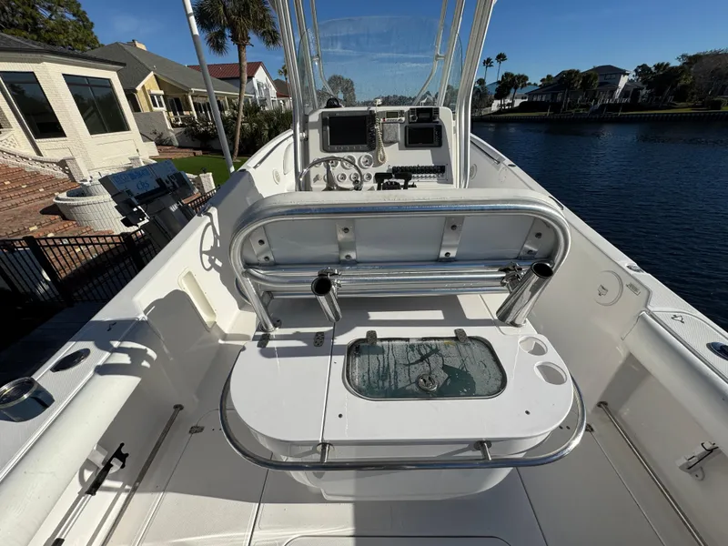 Slide: The Image of 2007 Pro-Line 29 Super Sport boat interior with fishing equipment and control panel. - 15