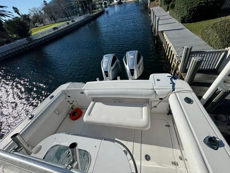 Slide: The Image of 2007 Pro-Line 29 Super Sport boat docked by a scenic canal. - 19