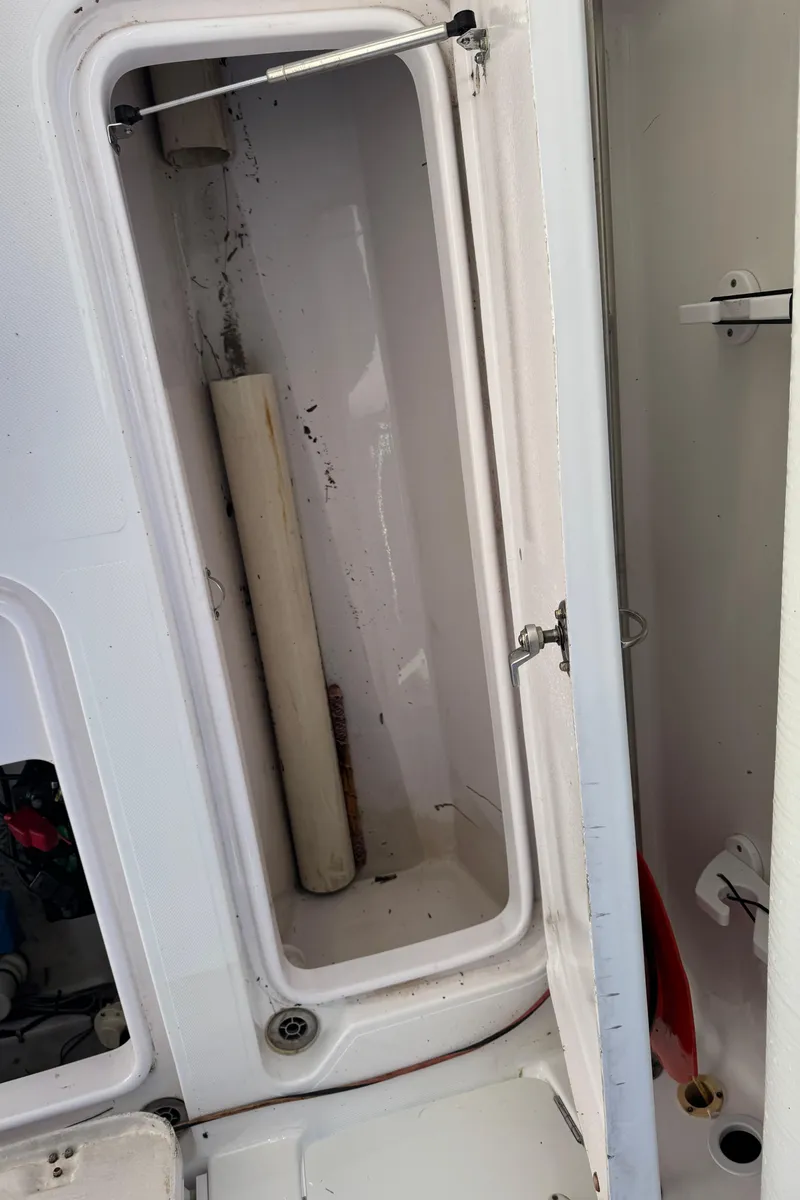 Slide: The Image of Open storage compartment on 2007 Pro-Line 29 Super Sport boat. - 20
