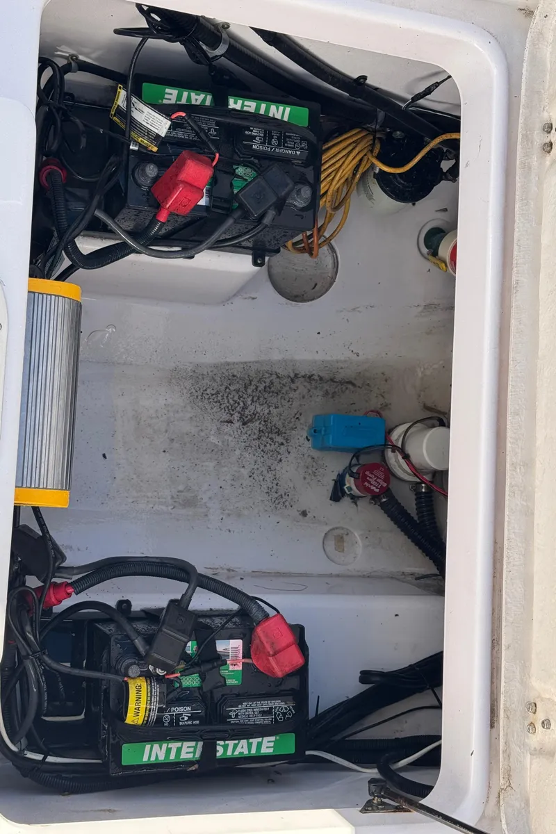 Slide: The Image of 2007 Pro-Line 29 Super Sport boat battery compartment with Interstate batteries. - 21
