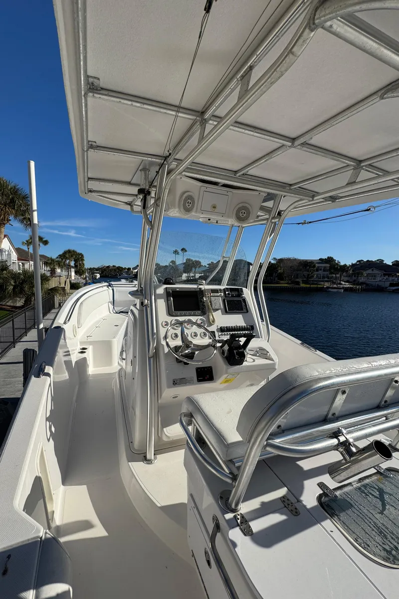 Slide: The Image of 2007 Pro-Line 29 Super Sport boat with sleek console and waterfront view. - 24