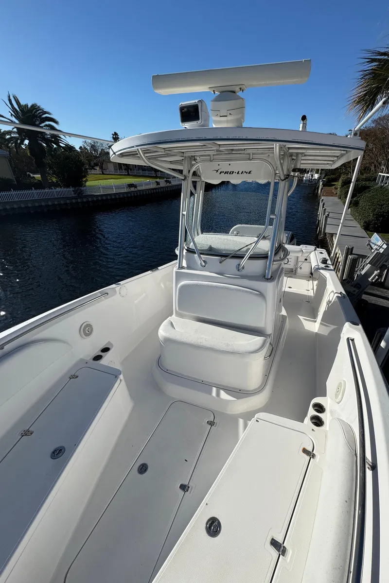 Slide: The Image of 2007 Pro-Line 29 Super Sport boat on a sunny canal. - 30