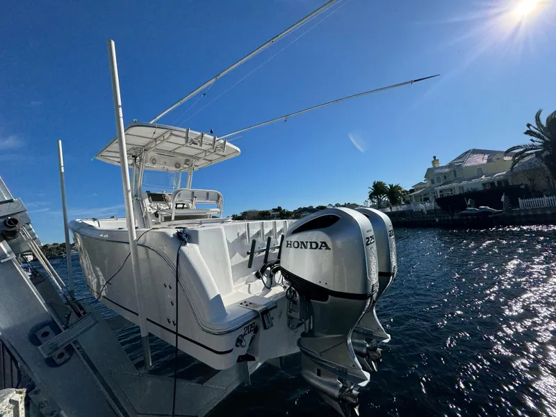 Slide: The Image of 2007 Pro-Line 29 Super Sport boat with Honda outboard motor on a sunny day. - 5