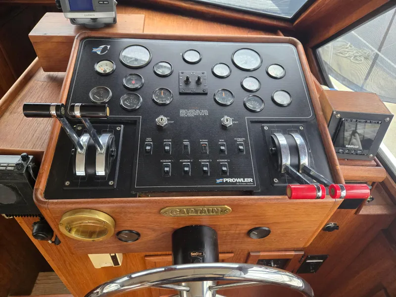 Slide: The Image of Control panel of a 1991 Cooper Prowler boat with gauges and switches. - 12