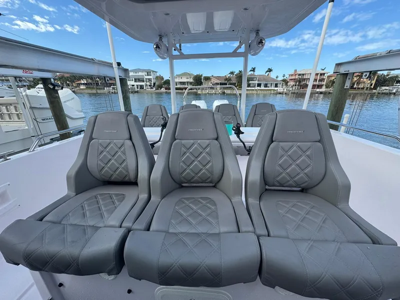 Slide: The Image of Luxurious seating on 2021 Axopar 37ST boat with waterfront view. - 12