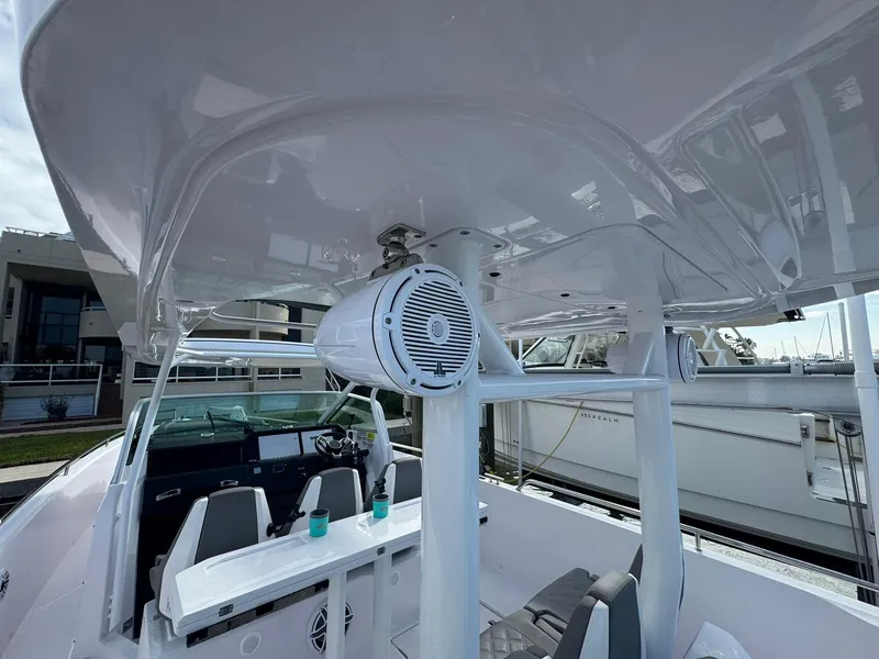 Slide: The Image of 2021 Axopar 37ST boat interior with seating and speaker system. - 25