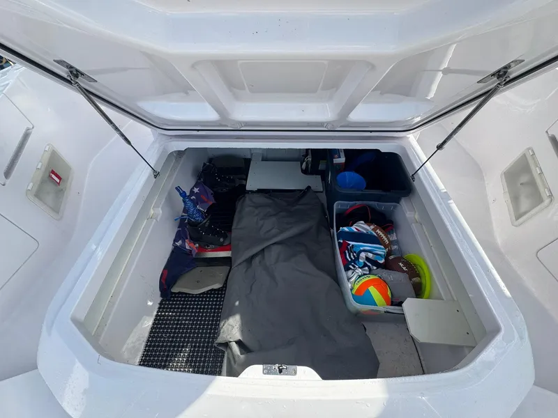 Slide: The Image of Storage compartment of 2021 Axopar 37ST boat with organized gear and accessories. - 28