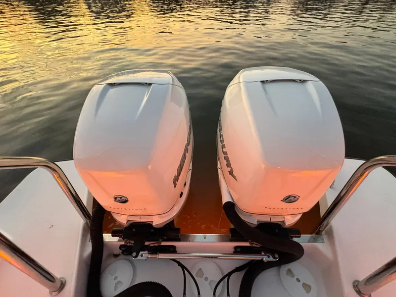 Slide: The Image of Twin Mercury outboard engines on a 2021 Axopar 37ST at sunset. - 39