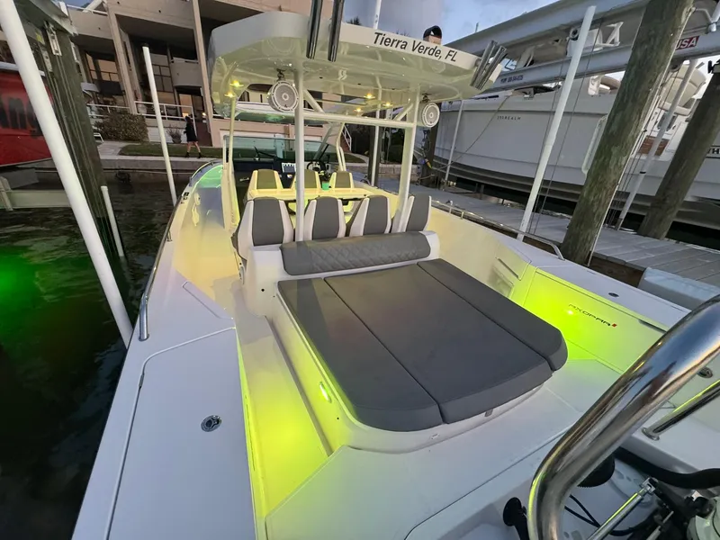 Slide: The Image of 2021 Axopar 37ST boat with illuminated deck and seating, docked at marina. - 42