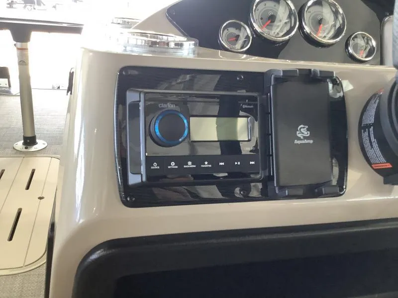Slide: The Image of 2025 G3 SELECT 324SS boat dashboard with stereo and gauges. - 14