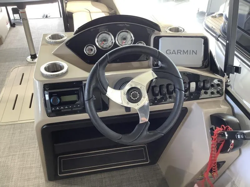 Slide: The Image of 2025 G3 SELECT 324SS boat dashboard with Garmin navigation system and modern controls. - 15