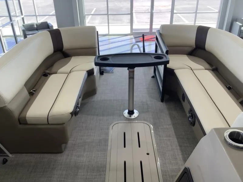Slide: The Image of 2025 G3 SELECT 324SS boat interior with beige seating and central table. - 9