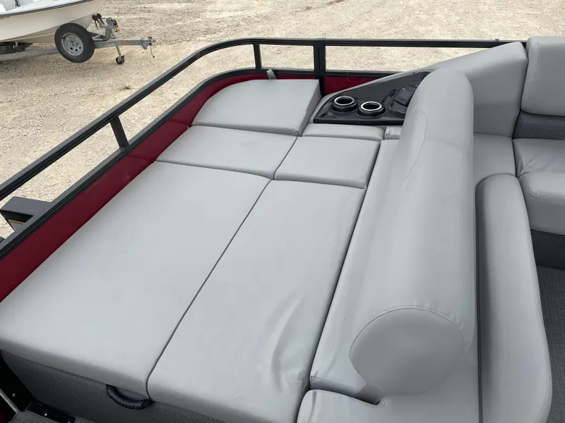 Slide: The Image of 2023 Regency 250 DL3 boat interior with gray seating and cup holders. - 10