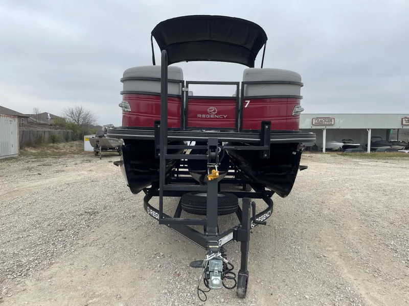 Slide: The Image of 2023 Regency 250 DL3 pontoon boat on trailer, rear view. - 8