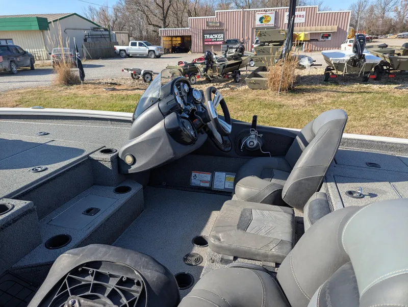 Slide: The Image of 2019 Tracker Pro Team 195 TXW Tournament Edition boat interior with steering console and seating. - 12