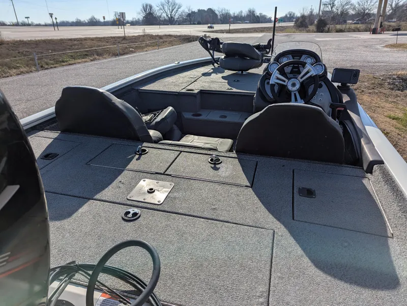 Slide: The Image of 2019 Tracker Pro Team 195 TXW Tournament Edition boat interior with steering wheel and seating. - 13