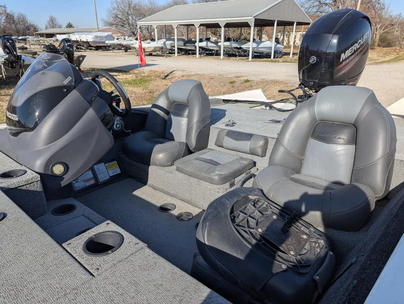 Slide: The Image of 2019 Tracker Pro Team 195 TXW Tournament Edition boat interior with seating and controls. - 15