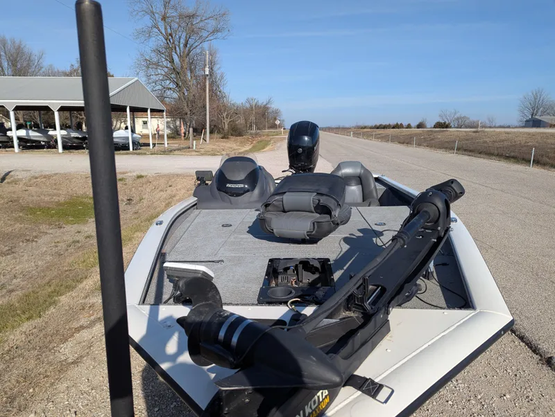 Slide: The Image of 2019 Tracker Pro Team 195 TXW Tournament Edition boat on a rural road. - 17