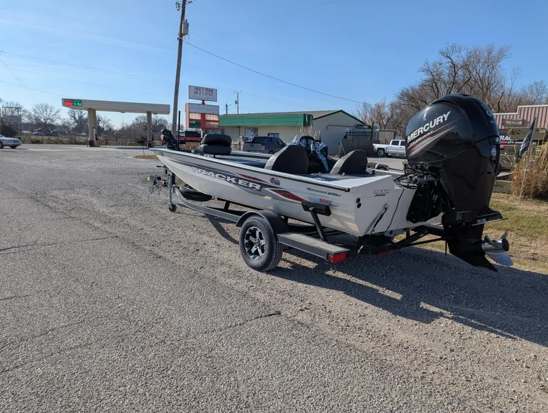 Slide: The Image of 2019 Tracker Pro Team 195 TXW Tournament Edition boat on trailer in parking lot. - 3