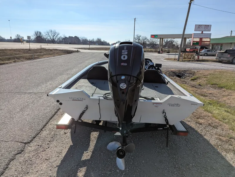 Slide: The Image of 2019 Tracker Pro Team 195 TXW Tournament Edition boat on trailer, rear view, parked on roadside. - 5
