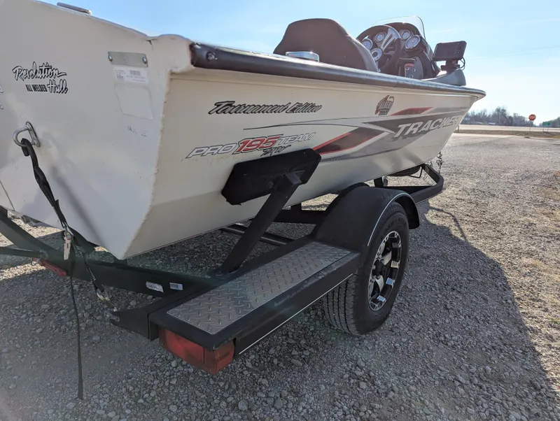 Slide: The Image of 2019 Tracker Pro Team 195 TXW Tournament Edition boat on trailer, side view. - 6