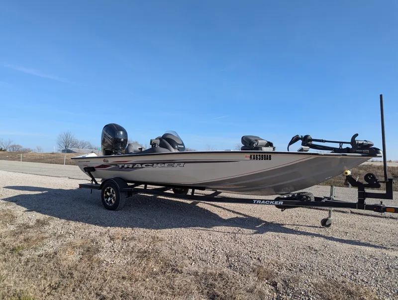 Slide: The Image of 2019 Tracker Pro Team 195 TXW Tournament Edition boat on trailer, parked outdoors. - 9