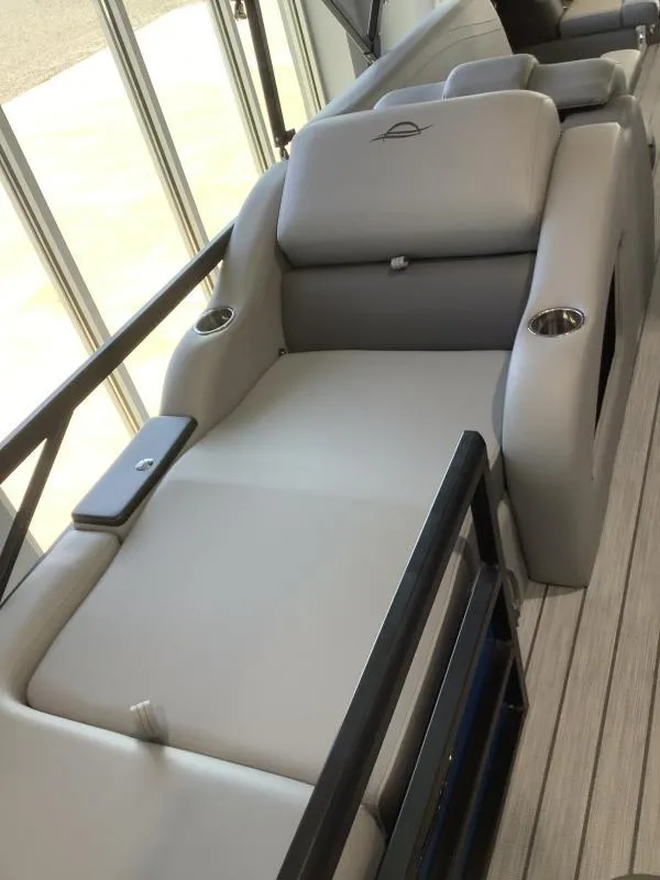Slide: The Image of 2025 G3 FUSION 324SS boat interior with plush seating and cup holders. - 13