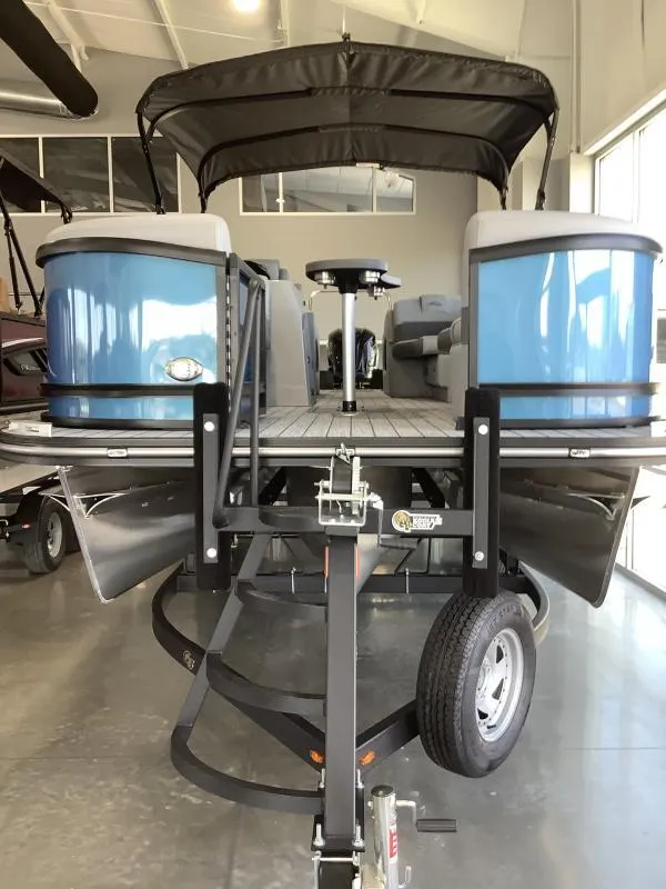 Slide: The Image of 2025 G3 FUSION 324SS pontoon boat in showroom, front view. - 2