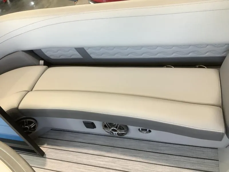Slide: The Image of 2025 G3 FUSION 324SS boat interior with beige seating and built-in speakers. - 23