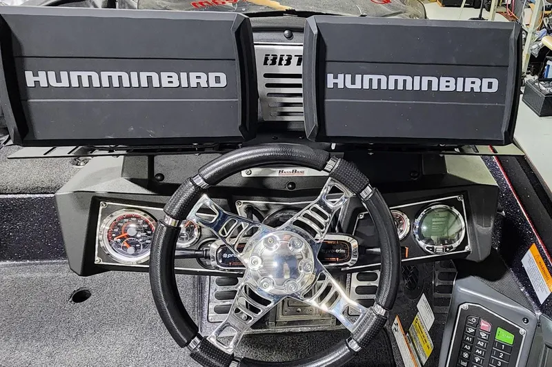 Slide: The Image of 2019 Ranger Z521L boat dashboard with dual Humminbird displays and steering wheel. - 10