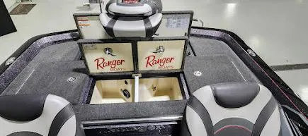 Slide: The Image of 2019 Ranger Z521L boat interior with dual screens and storage compartments. - 11