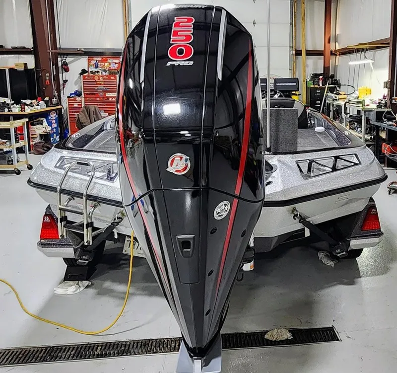 Slide: The Image of 2019 Ranger Z521L boat with 250 Pro outboard motor in a workshop. - 6