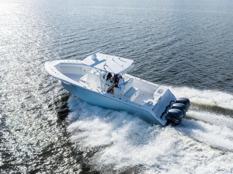 The Image of 2018 SeaHunter 33' Center Console boat cruising on open water. - 0