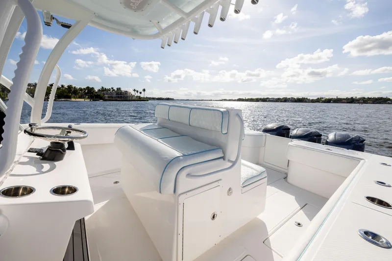 Slide: The Image of 2018 SeaHunter 33' Center Console boat on calm water, sunny day. - 14