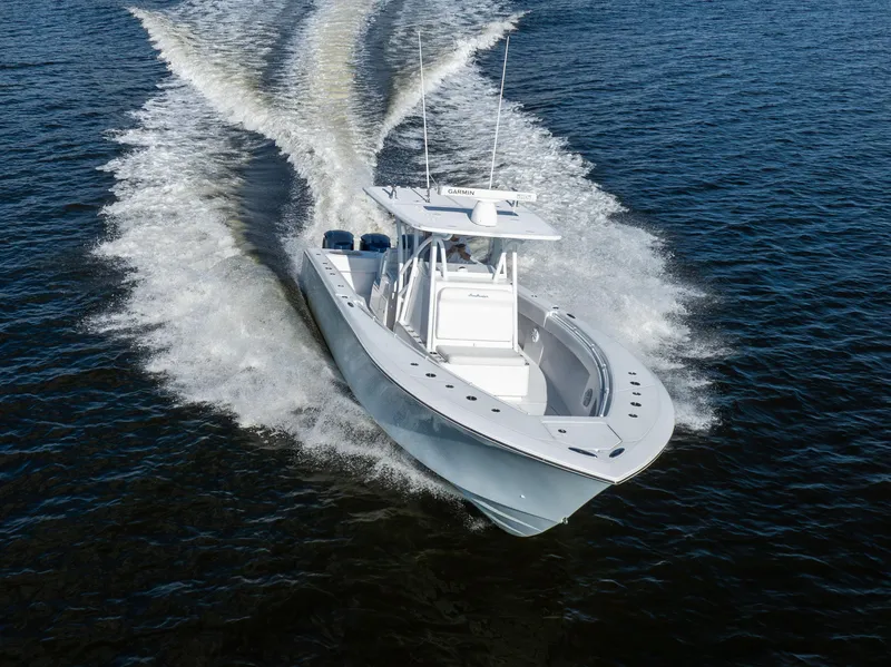 Slide: The Image of 2018 SeaHunter 33' Center Console boat cruising on open water. - 29