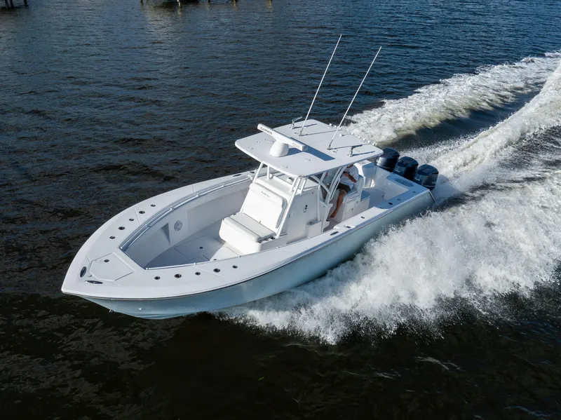 Slide: The Image of 2018 SeaHunter 33' Center Console boat cruising on open water. - 30