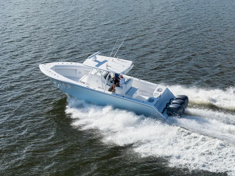 Slide: The Image of 2018 SeaHunter 33' Center Console boat cruising on open water. - 32