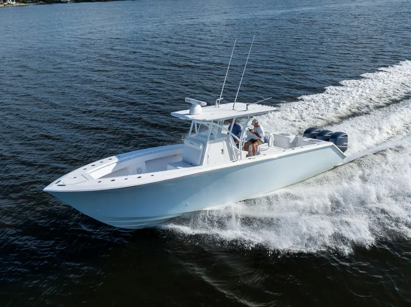 Slide: The Image of 2018 SeaHunter 33' Center Console boat cruising on open water. - 34