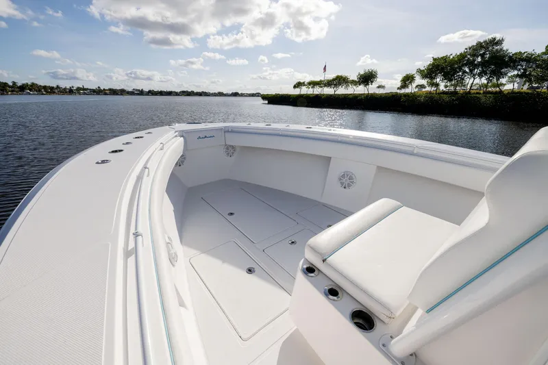 Slide: The Image of 2018 SeaHunter 33' Center Console boat on calm water, sunny day. - 5