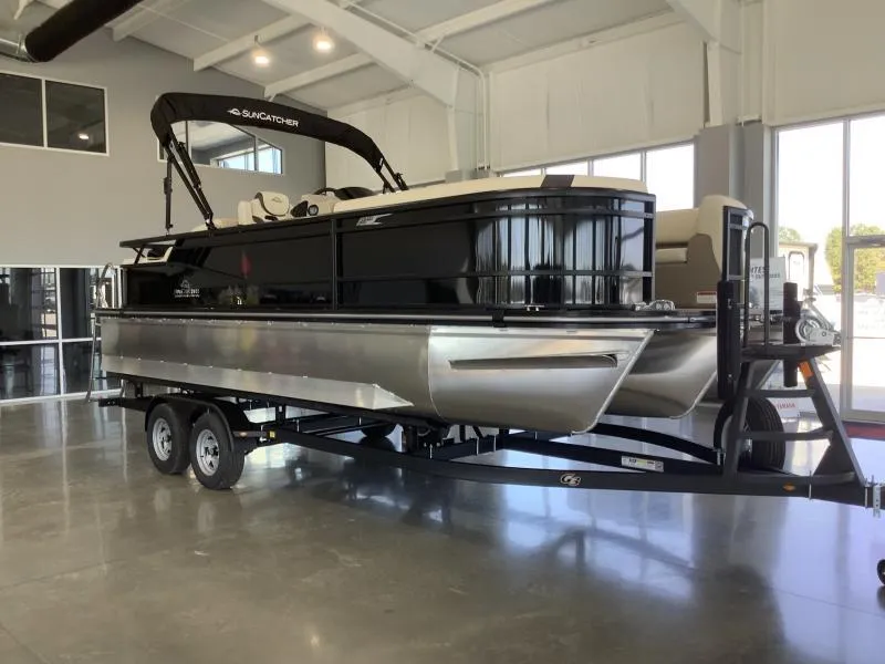 The Image of 2025 G3 Select 322SS pontoon boat on trailer in showroom. - 1