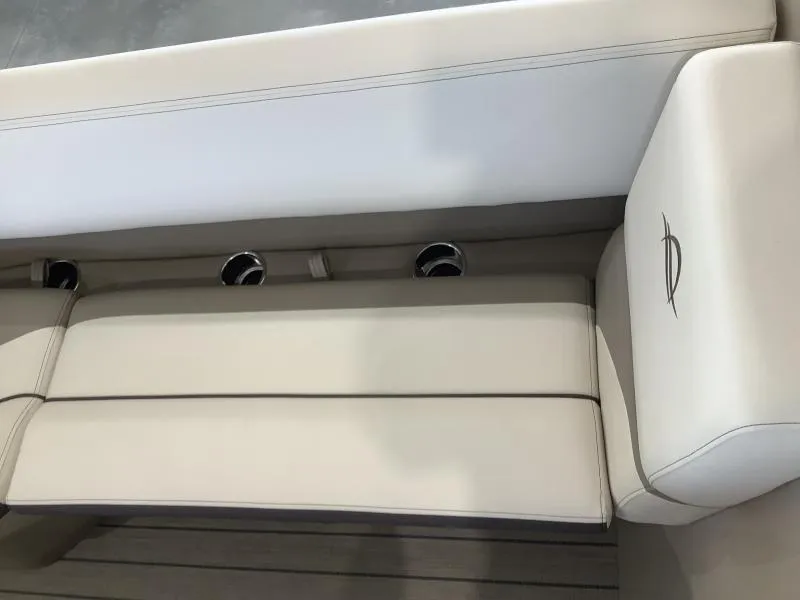 Slide: The Image of 2025 G3 Select 322SS boat seating with cup holders and white upholstery. - 19