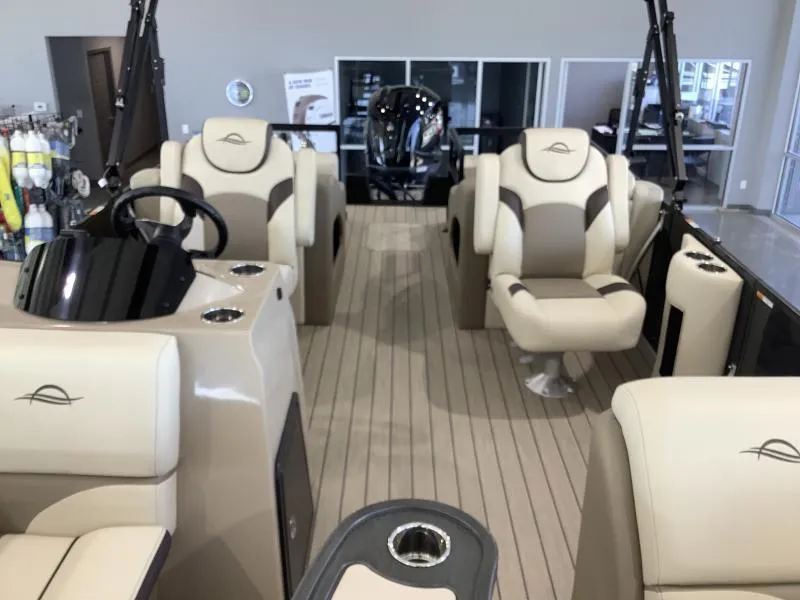 Slide: The Image of 2025 G3 Select 322SS boat interior with beige seating and modern design. - 7