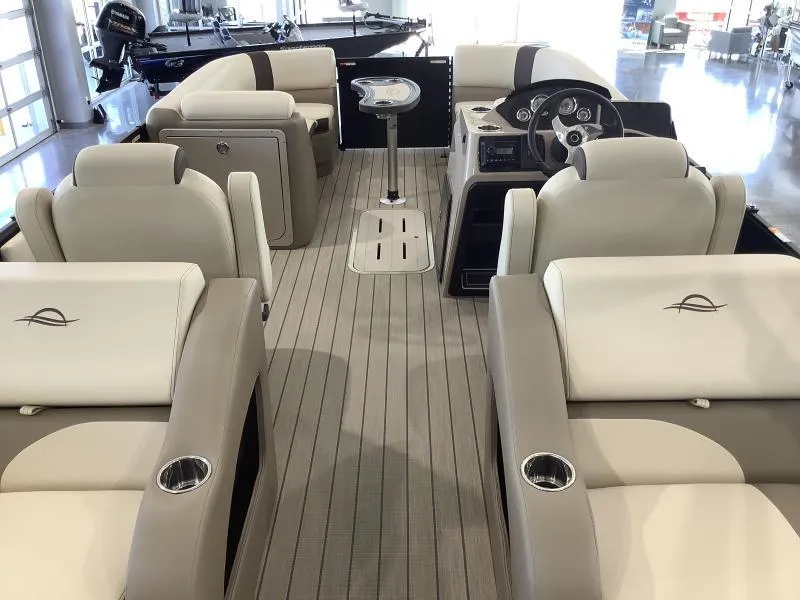 Slide: The Image of 2025 G3 Select 322SS pontoon boat interior with luxurious seating and modern steering console. - 8