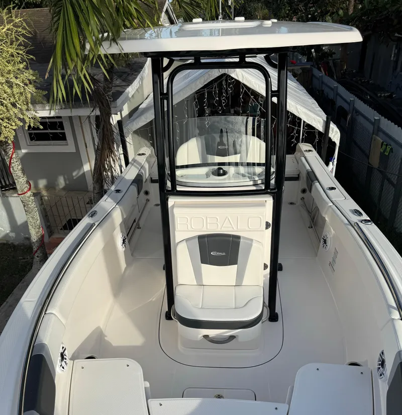 Slide: The Image of 2022 Robalo R230 Center Console boat with T-top and spacious deck. - 11