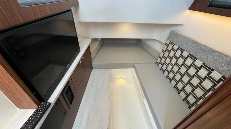 Slide: The Image of Interior of 2022 Pursuit S 358 Sport boat with modern seating and entertainment area. - 17