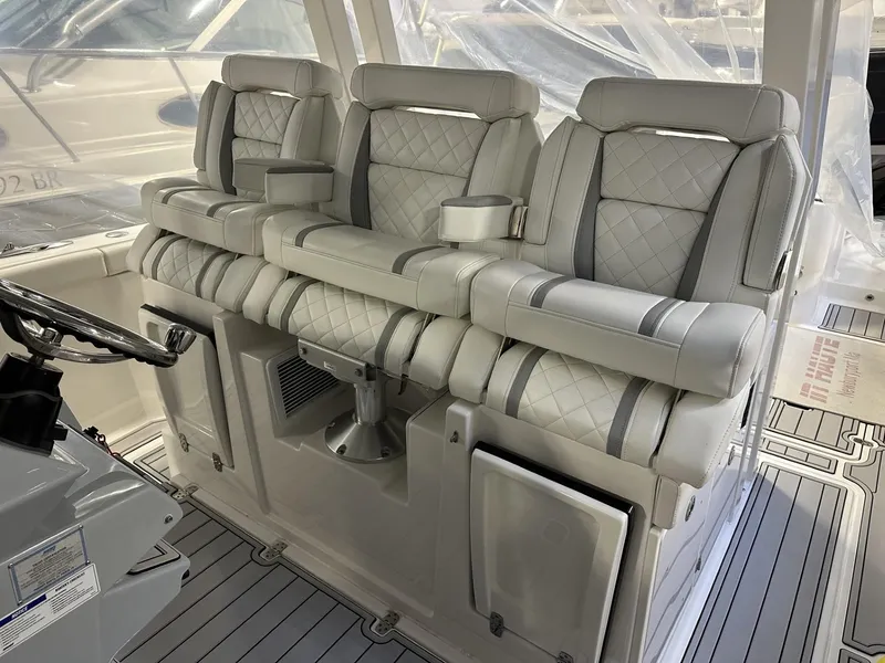 Slide: The Image of 2022 Pursuit S 358 Sport boat interior with luxurious seating and modern design. - 22