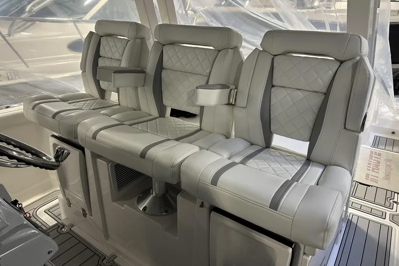 Slide: The Image of 2022 Pursuit S 358 Sport boat interior with luxurious seating and modern design. - 23