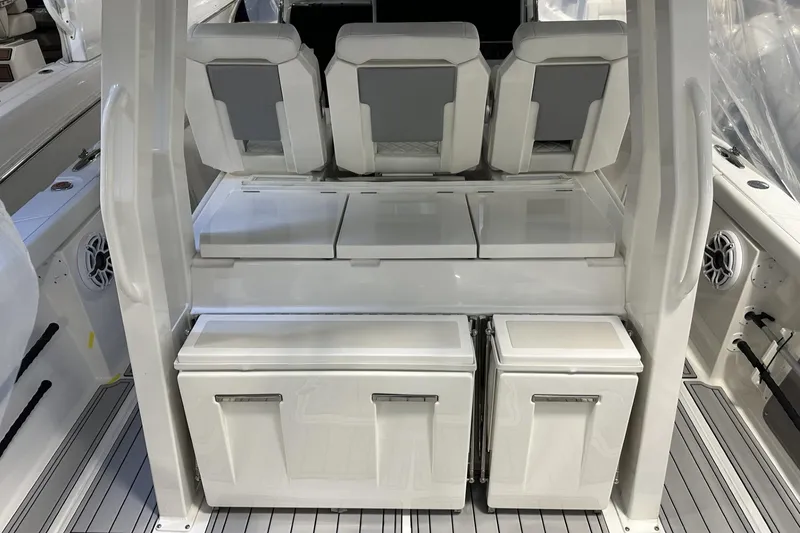 Slide: The Image of 2022 Pursuit S 358 Sport boat interior with sleek seating and storage compartments. - 24